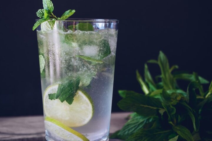 clear glass cup filled with water and lemon